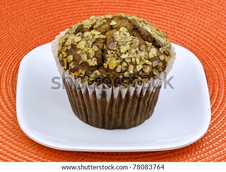 oat bran muffin on a white plate