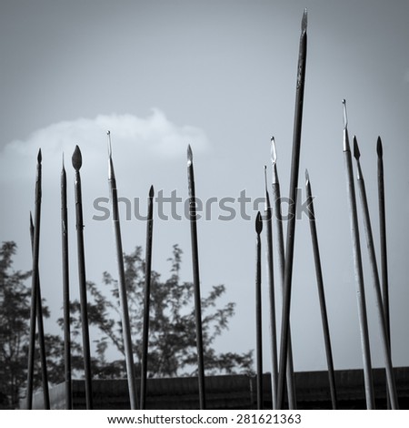 Medieval staged battle, in Quattro Castella - Italy, Rievocandum 2015 event. Spear heads stand close as the ranks are forming. Black and white style.