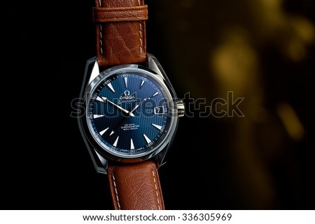 London, UK - 7 November 2015: Omega Seamaster Aqua Terra mechanical swiss watch.  This watch has a blue dial and a light brown camel leather strap.