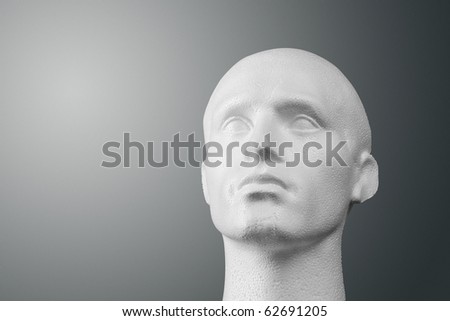 A studio lit white expanded polystyrene foam male head of generic design.  The file contains an accurate clipping path if you want a different background.