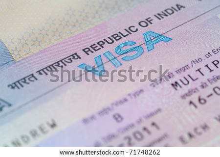 A closeup of an Indian business visa vignette inside a passport.  Shallow DoF with focus on the word "VISA".