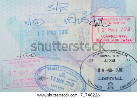 A number of stamps in a UK passport for a trip to Africa.