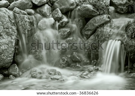 Ever Dream - little waterfalls in black & white flowing between the rocks