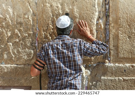 Jerusalem, Israel - November 9, 2014 : A jewish Man pray at the western wall. The western wall is an exposed section of ancient wall situated on the western flank of the Temple Mount.
