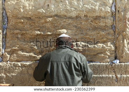 Jerusalem, Israel - November 9, 2014 : Jewish orthodox man pray at the western wall. The western wall is an exposed section of ancient wall situated on the western flank of the Temple Mount.