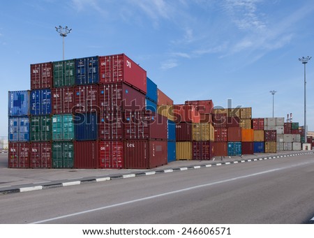 Haifa, Israel - January 23, 2015: Various brands and colors of shipping containers stacked in a holding platform