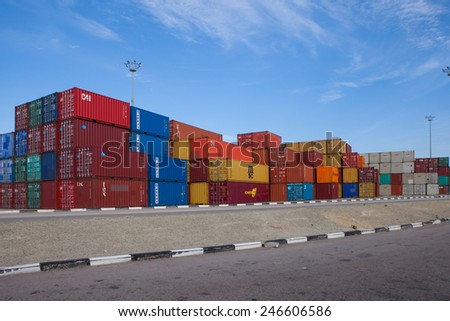 Haifa, Israel - January 23, 2015: Various brands and colors of shipping containers stacked in a holding platform