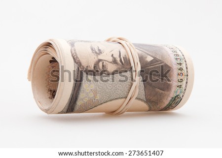 Japanese Yen notes rolled with rubber band