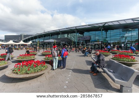Amsterdam, The Netherlands - May 1, 2015: Main entrance to Schiphol Airport. Schiphol airport handles over 45 million passengers per year with almost 100 airlines flying from here