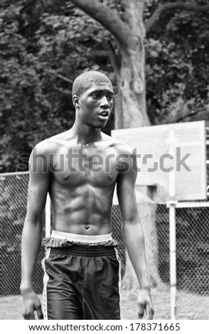 NEW YORK CITY - JUNE 22: A black boy play in Harlem basketball court, taken on June 22, 2008 in New York City, United States