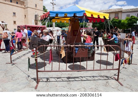 PASTRANA, SPAIN: 20 JULY: Human powered carousel at Ducal Festival of Pastrana, Guadalajara. On july 20, 2014.