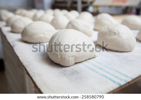 Raw pieces of bread dough before fermentation. Manufacturing process of spanish bread