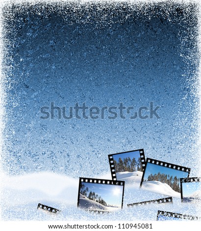 Beautiful winter frozen background with film frames and a snow