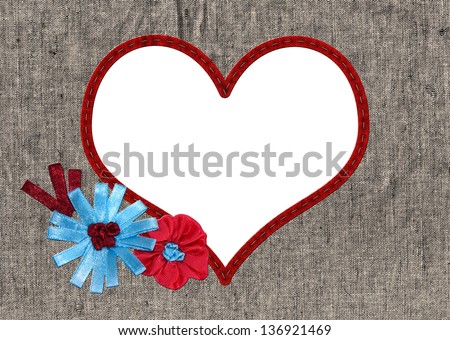 Embroidered heart frame with satin ribbons of old linen