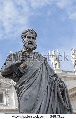 statue of St. Peter holding a key in St. Peter\'s Square at the Vatican