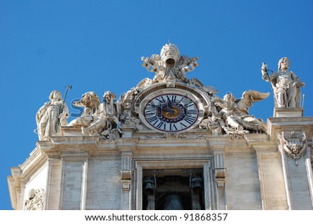 view of the clock with bell in the top corner of the St. Peter\'s basilica in Rome, italy