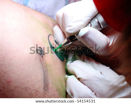 tattoo artist at work. stock photo : Tattoo artist at work