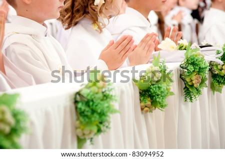 children accepting the first Holy Communion