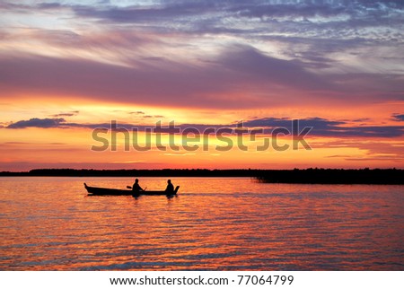 sunset on the lake, boat silhouette