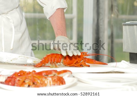 Chef preparing lobsters at a corporate meeting