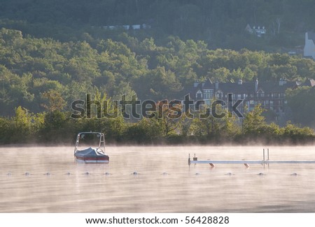 Fog and boat on the lake
