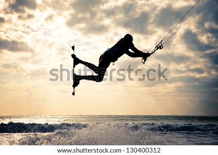 KITE BOARDING. Kite surfer jumping.