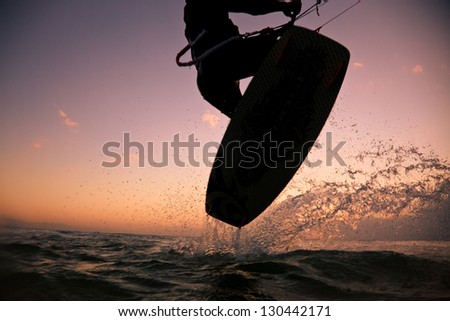 Kite boarding. Kitesurf freestyle at sunset.