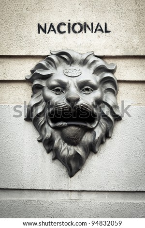 Old bronze mail box in the shape of a lion\'s head. Retro look.