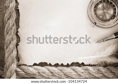 ropes and compass on old vintage ancient paper background texture