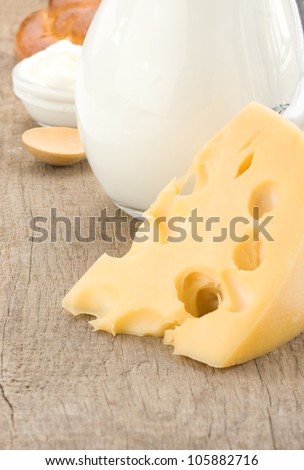 milk products cheese on wooden background