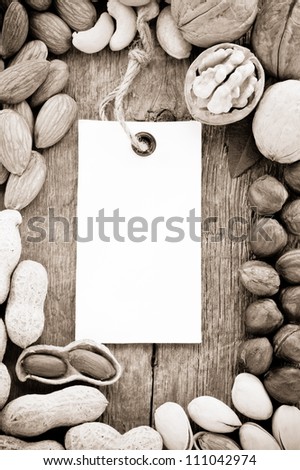set of nuts fruit and tag label on wood background texture