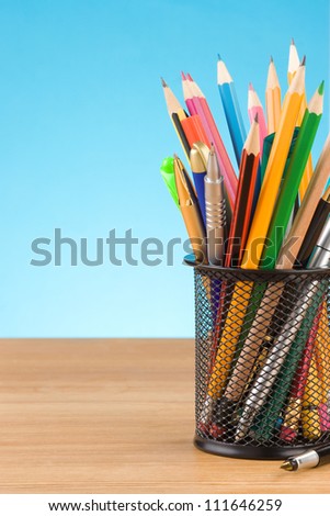 back to school concept and office supplies on blue background