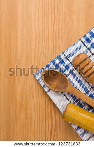 wood utensils with napkin at background
