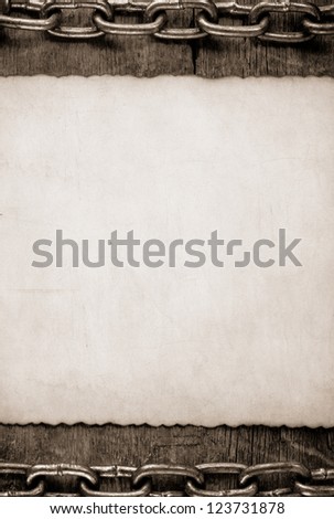 paper vintage and metal chain on wood background