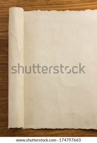 Parchment Scroll On Wooden Background