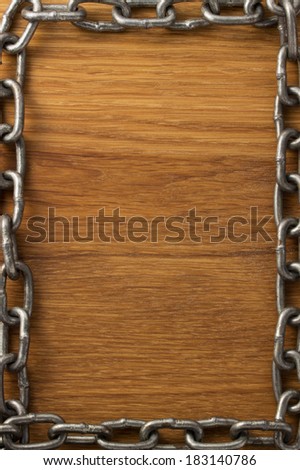 metal chain on wooden background