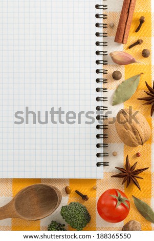 food ingredients and recipe book on napkin