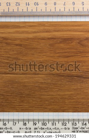 checked note paper on wooden background