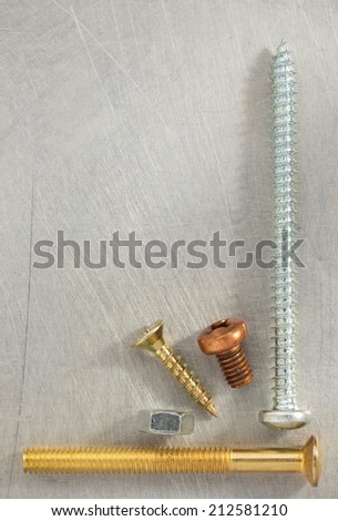 bolt, screws and nuts tool at metal background texture