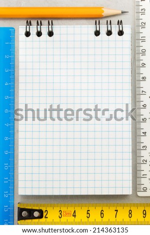 checked note paper at metal background texture