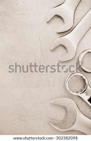 wrench tools at metal background