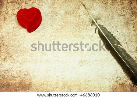 old paper with heart and feather