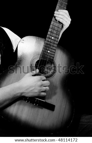 black and white guitar player. stock photo : black and white image of guitar player