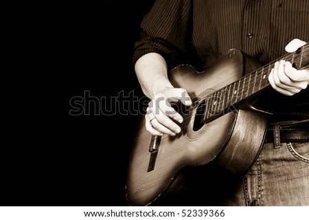 sepia image of guitar and man