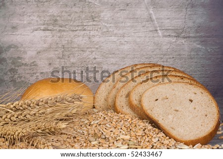 wheat ear and bread near the wall