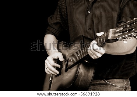 guitar and man in sepia