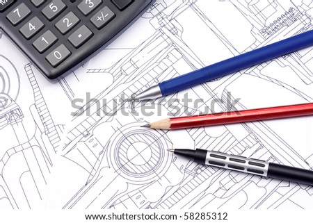 calculator, pens and pencil at draft