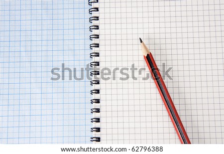 graph grid paper and notebook with pencil