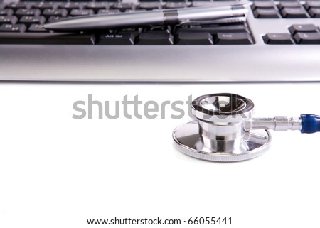 shiny stethoscope and keyboard background isolated on white background
