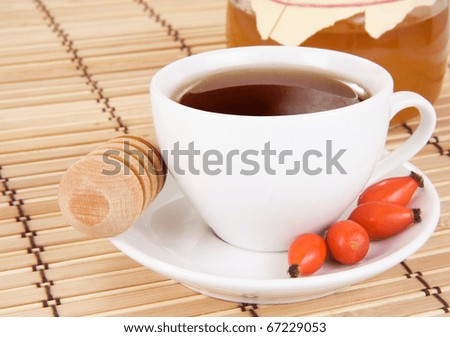 berry dog tea and honey on wood